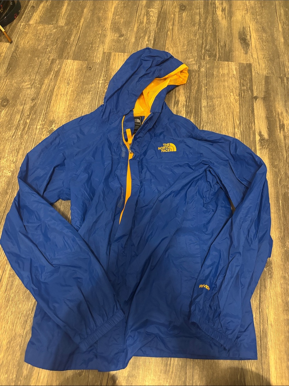The North Face Men’s Royal Blue Windbreaker with Yellow Accents